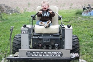 Blue learns to mow toddler on mower, dixie chopper