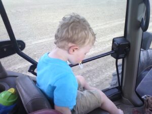 toddler sleeps in tractor